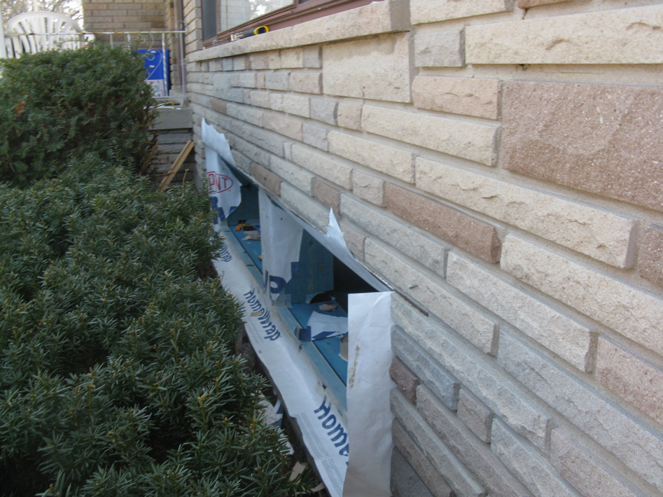 Window sill pan using flashing tape with custom back dam